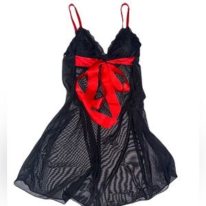 black sheer/lace top with red silk bow.